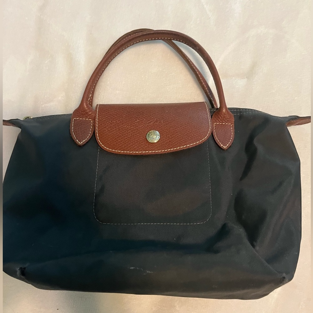 Small well-loved navy Longchamp bag